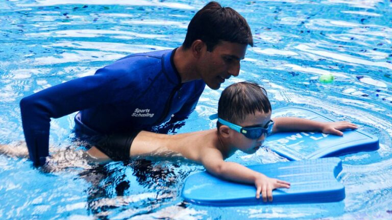 A Child Learning to Swim at The Swim Lab