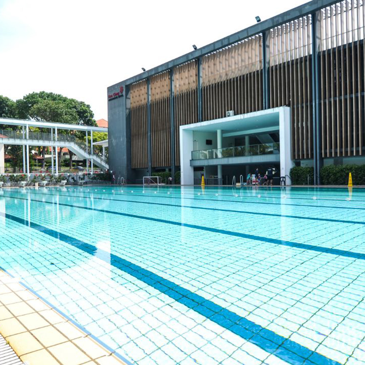 Lush, expansive view of the pristine swimming pool at Hwa Chong