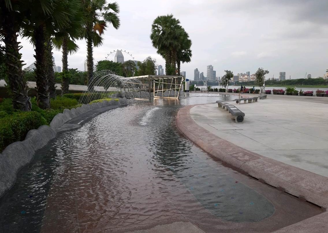 Visitors enjoying the open space and water features at Marina Barrage, Marina Bay.