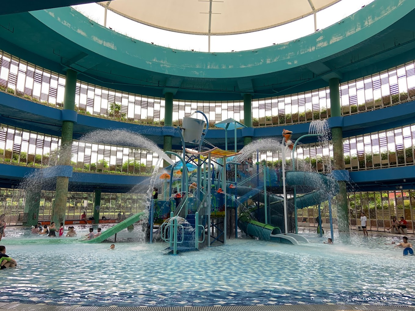 Indoor water playground in Punggol, Safra, featuring 5 slides, 8 play decks connected by climbing structures, and a toddler wading area.